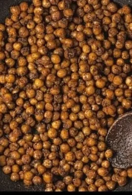 A plate of 20-minute vegan chickpea tacos topped with fresh ingredients and lime.