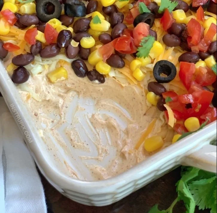 Delicious 7 Layer Taco Dip served in a bowl, perfect for parties and gatherings.