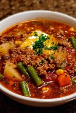 Bowl of hearty Cowboy Soup with beans, corn, and spices
