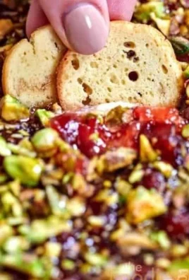 Delicious Cranberry Whipped Feta Dip served in a bowl with crackers.