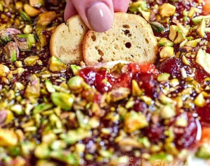 Delicious Cranberry Whipped Feta Dip served in a bowl with crackers.