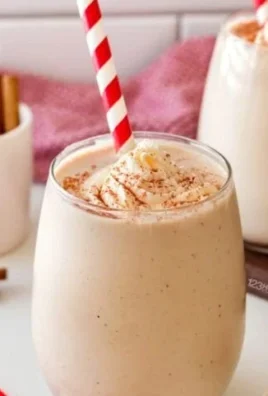 Creamy homemade eggnog in a festive cup with a sprinkle of nutmeg