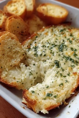 Creamy easy garlic bread dip served with crispy bread slices