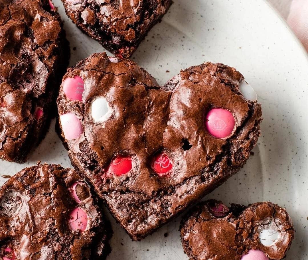 Delicious heart shaped brownies on a plate, perfect for sharing and gifting.