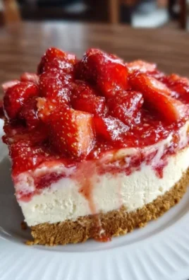 Irresistible strawberry crunch cheesecake with creamy layers and crunchy topping