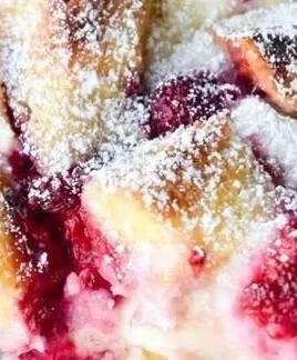 Raspberry Cheesecake French Toast Casserole with fresh raspberries and cream cheese