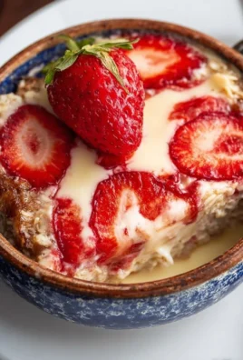 Delicious strawberry cheesecake baked oatmeal in a rustic dish.