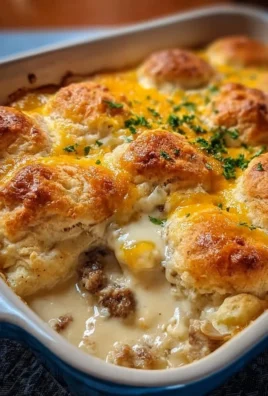 Delicious ultimate breakfast casserole with biscuits and gravy served in a baking dish